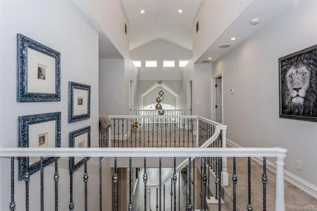 a view of staircase with railing and wooden floor