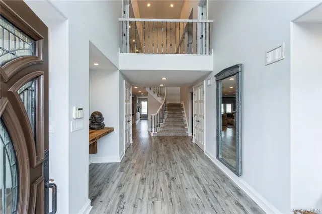 a view of hallway with wooden floor