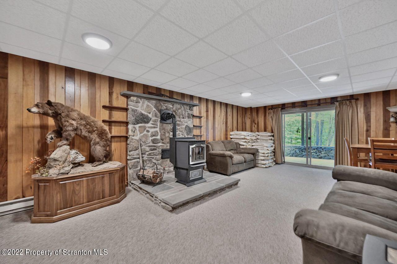 3560 State Rte 2012 Forest City, PA 18421 - Photo 33 of 63 a living room with furniture a couch and a flat screen tv