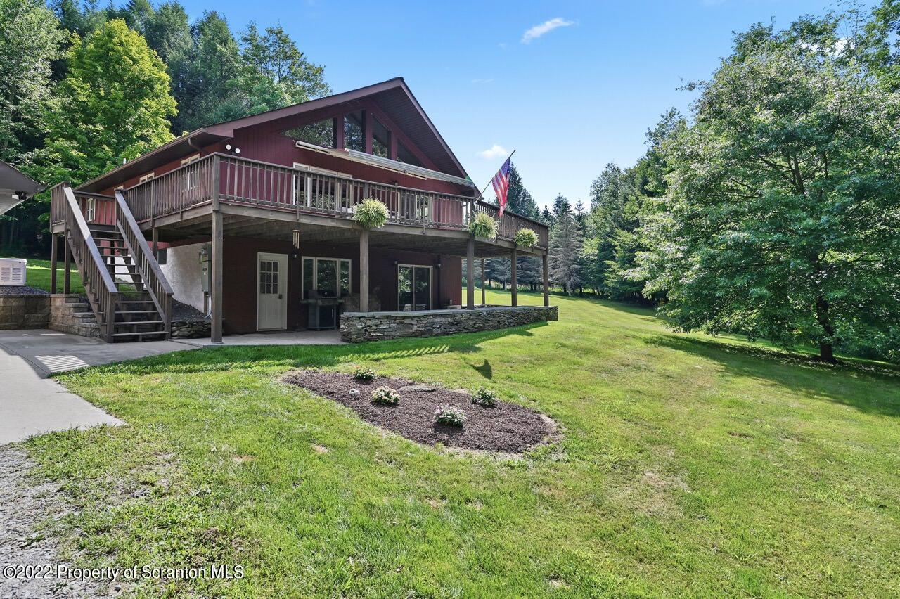 3560 State Rte 2012 Forest City, PA 18421 - Photo 47 of 63 a view of a house with backyard and porch