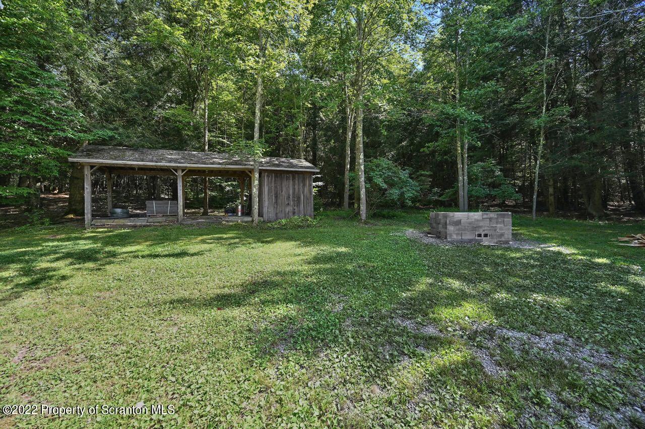 3560 State Rte 2012 Forest City, PA 18421 - Photo 53 of 63 front view of a house with backyard and a tree