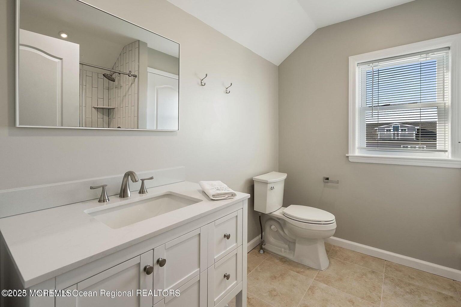 32 Niblick Street Point Pleasant Beach, NJ 08742 - Photo 14 of 31 a bathroom with a sink toilet and mirror