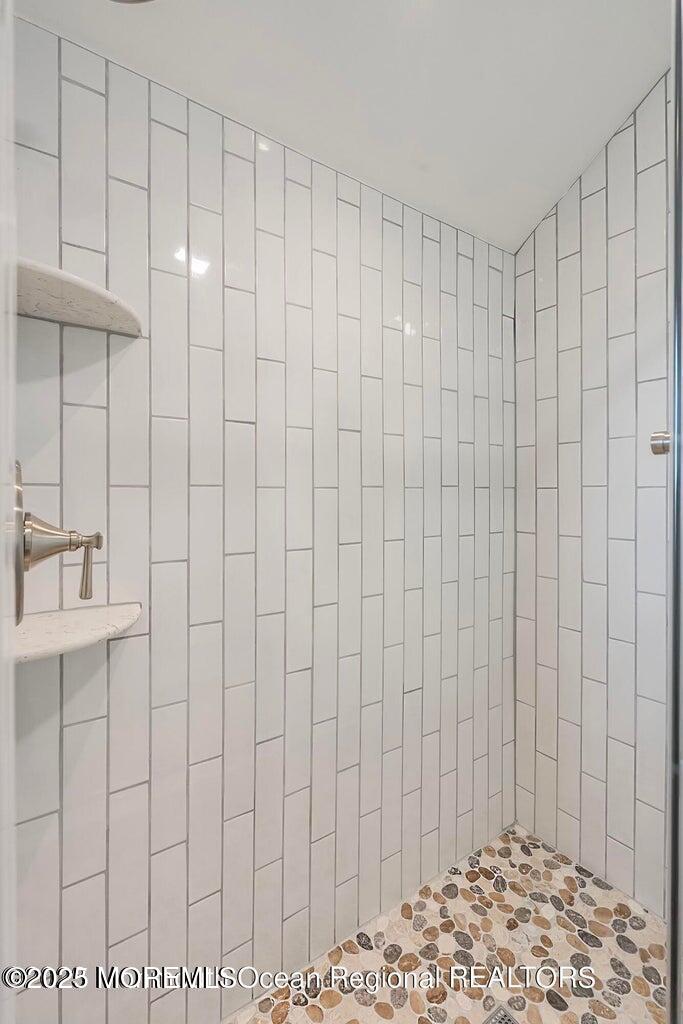 32 Niblick Street Point Pleasant Beach, NJ 08742 - Photo 15 of 31 a bathroom with a shower