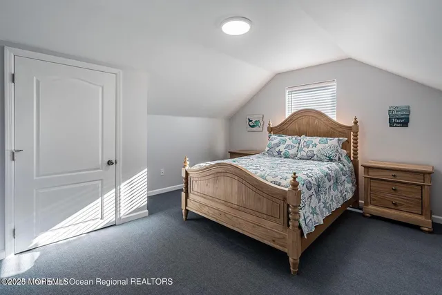 a bedroom with a bed and a cabinets