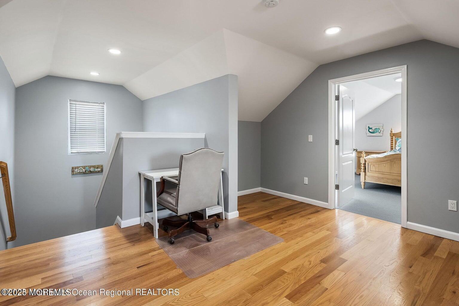 32 Niblick Street Point Pleasant Beach, NJ 08742 - Photo 20 of 31 a view of a room with wooden floor and furniture