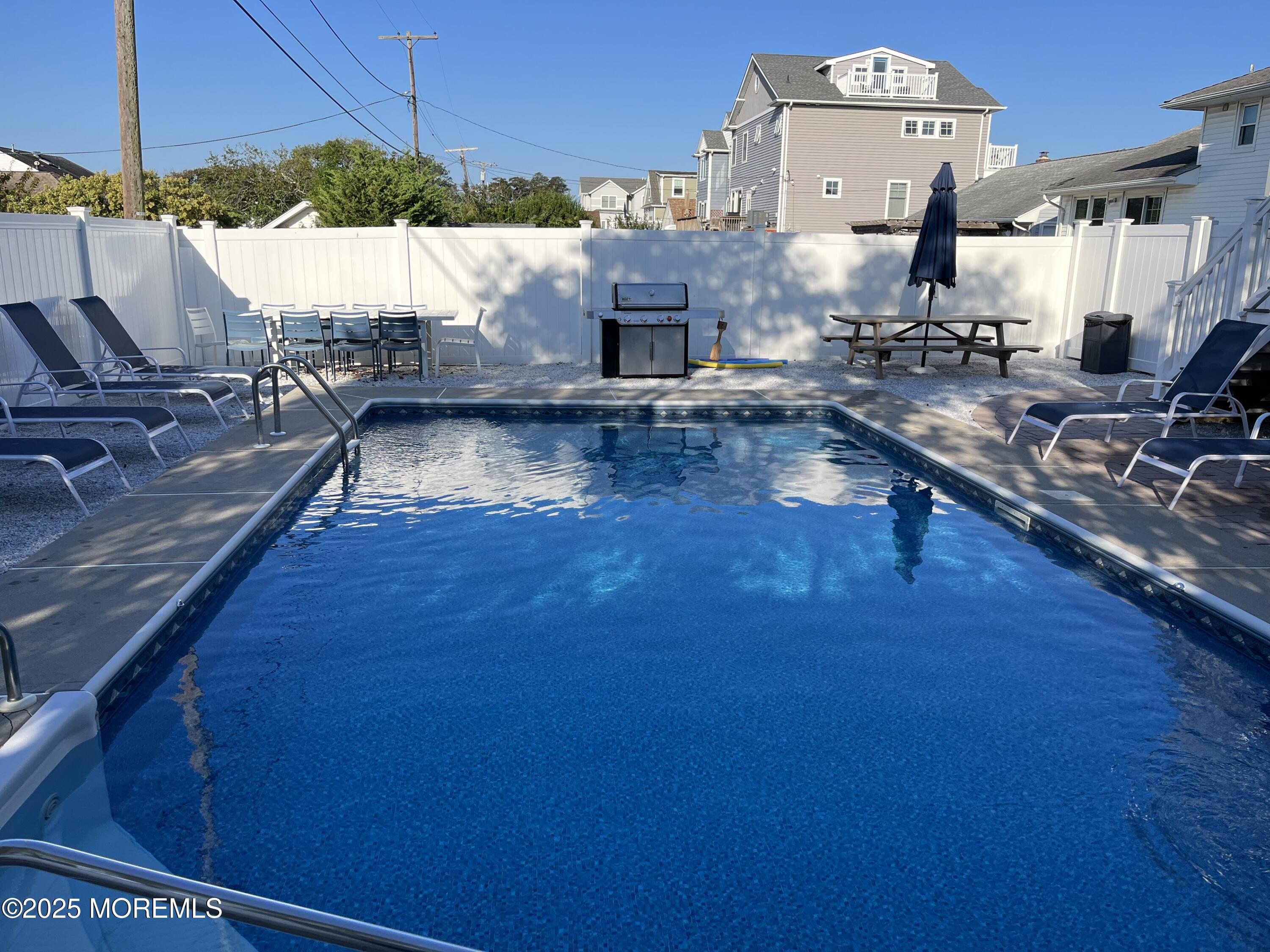 32 Niblick Street Point Pleasant Beach, NJ 08742 - Photo 21 of 31 a living room with furniture and a flat screen tv