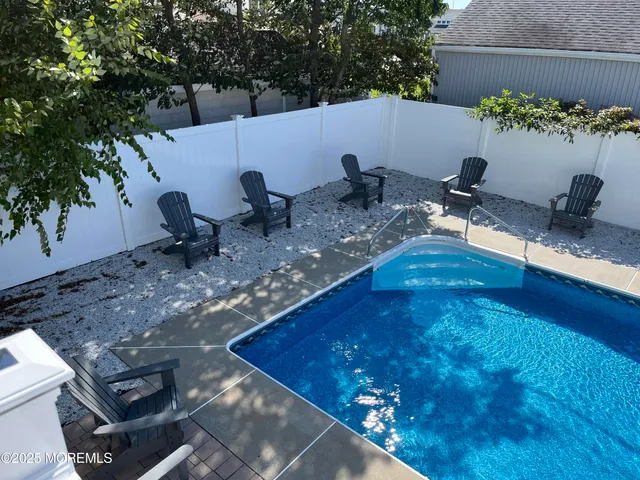 a view of a swimming pool with an outdoor space