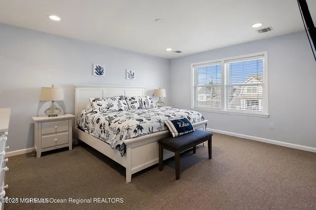 a bed room with a bed and a window