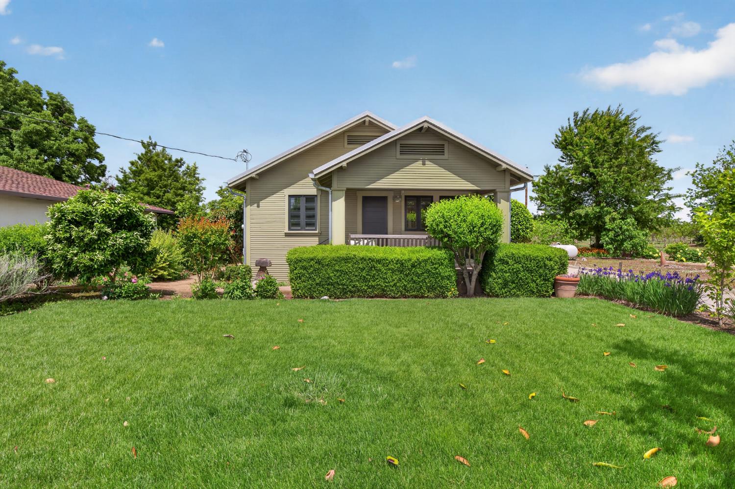 14621 East 8 Mile Road Linden, CA 95236 - Photo 2 of 38 a front view of a house with garden