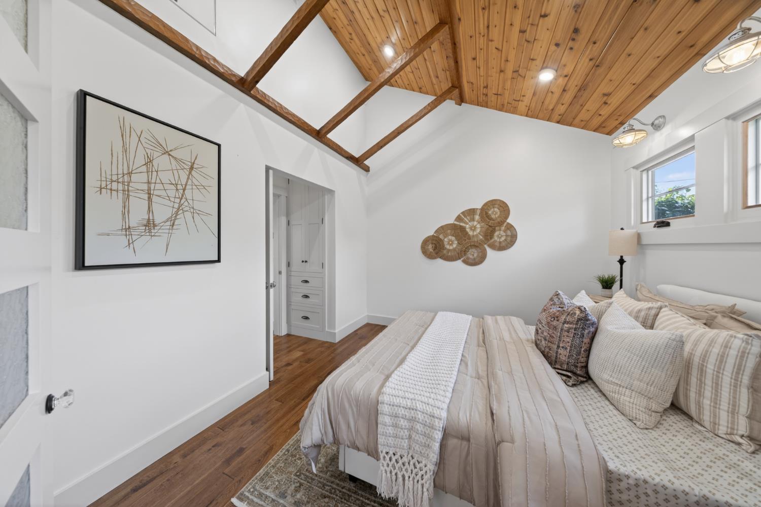 14621 East 8 Mile Road Linden, CA 95236 - Photo 22 of 38 a bedroom with a bed and a painting on the wall