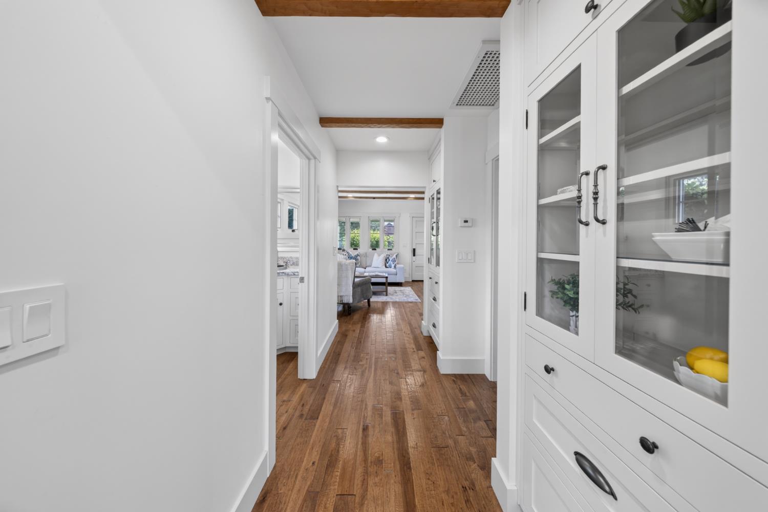 14621 East 8 Mile Road Linden, CA 95236 - Photo 23 of 38 a view of a hallway with wooden floor and a living room