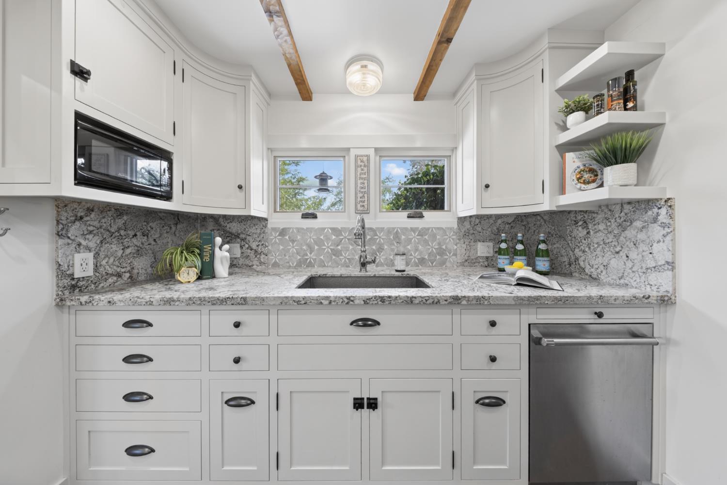 14621 East 8 Mile Road Linden, CA 95236 - Photo 25 of 38 a view of cabinets a oven a counter space and a window