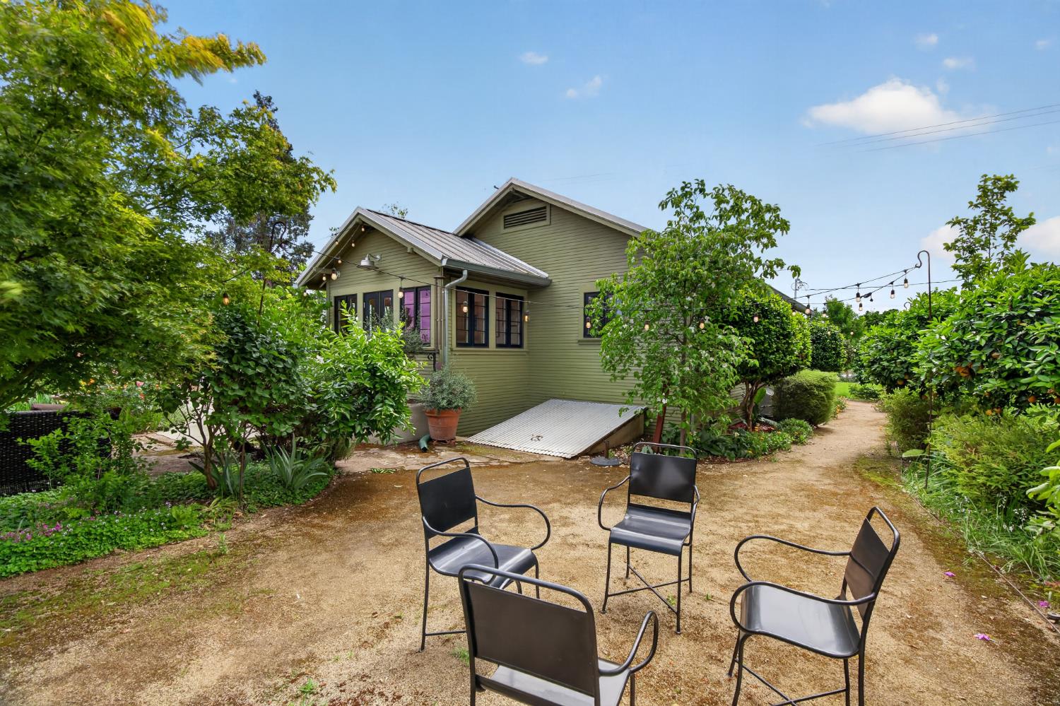 14621 East 8 Mile Road Linden, CA 95236 - Photo 31 of 38 a view of a chairs and table in the backyard