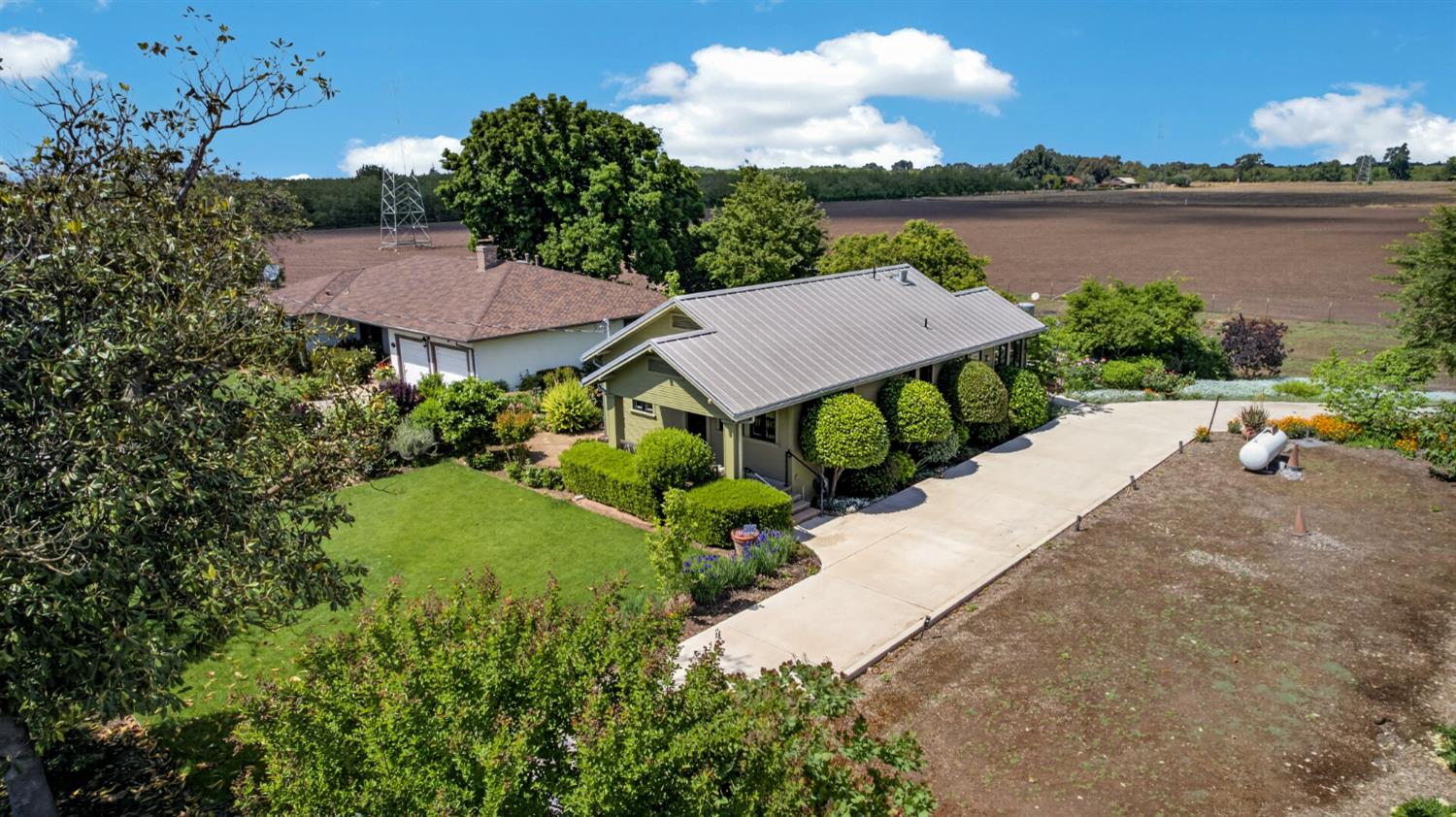 14621 East 8 Mile Road Linden, CA 95236 - Photo 35 of 38 an aerial view of a house with garden space and a swimming pool