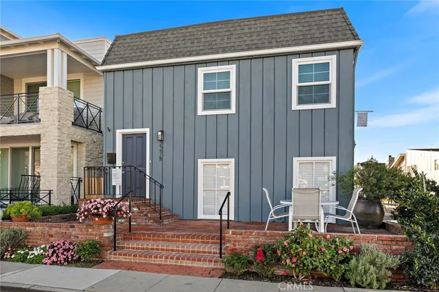 a view of a house with potted plants