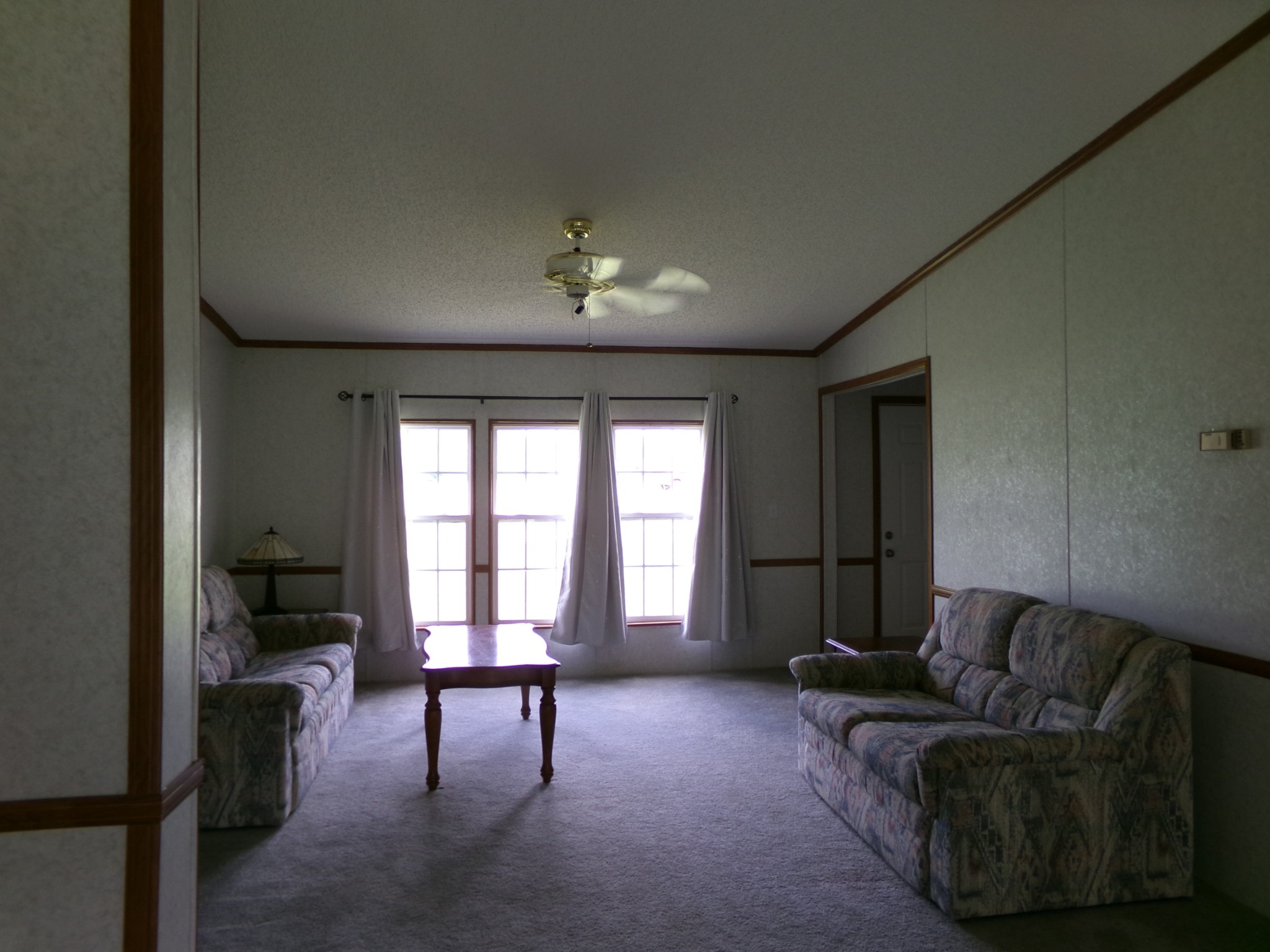 258 Paul Thompson Road Bethpage, TN 37022 - Photo 12 of 23 a living room with furniture and a large window