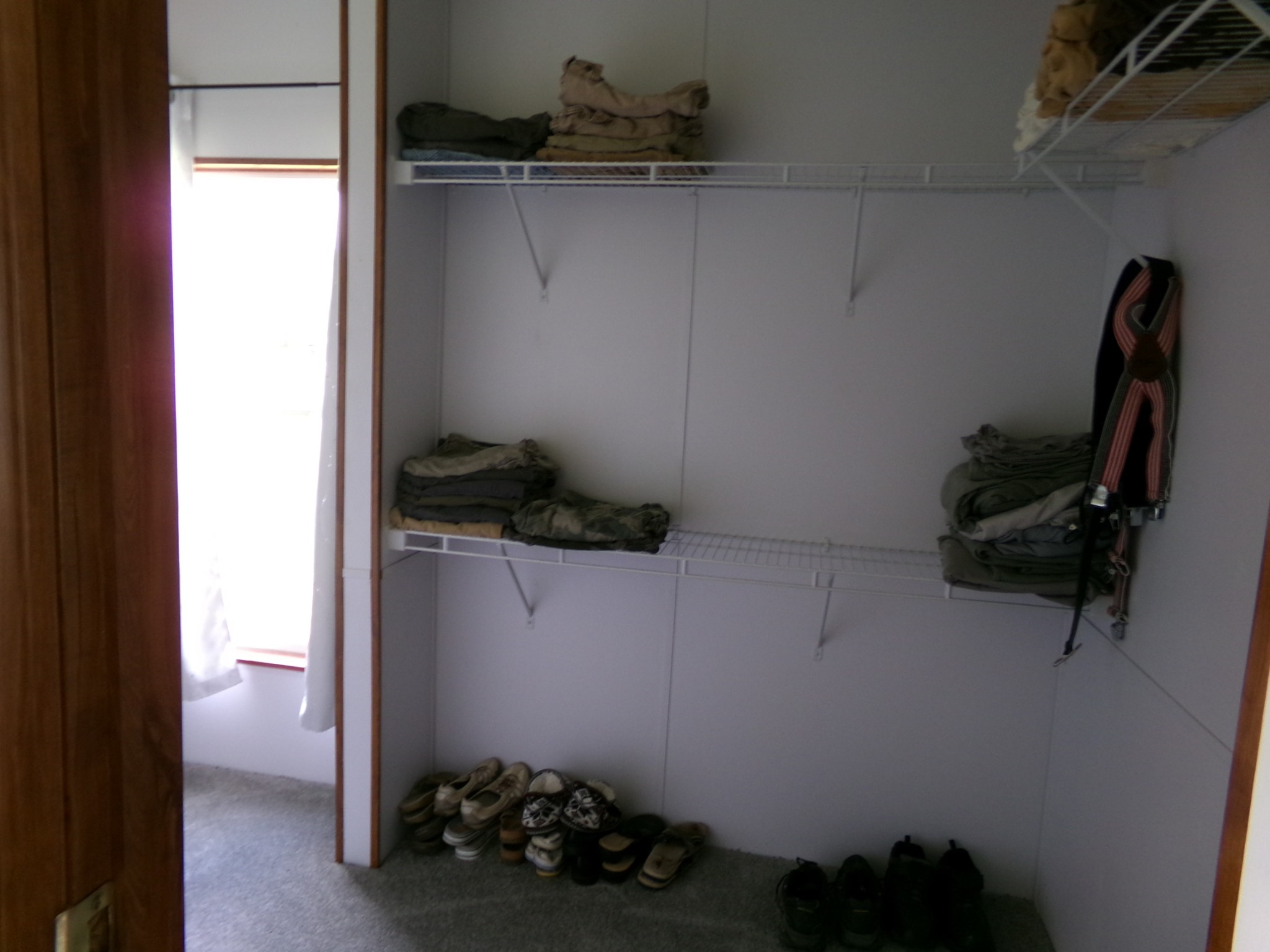 258 Paul Thompson Road Bethpage, TN 37022 - Photo 17 of 23 a room with water heater and racks on the wall