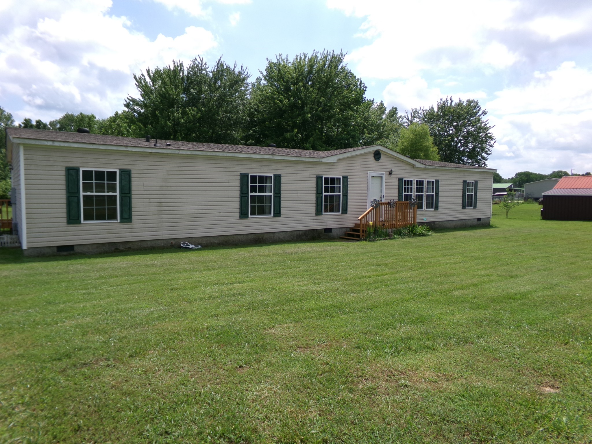258 Paul Thompson Road Bethpage, TN 37022 - Photo 2 of 23 a house that has a big yard with wooden fence