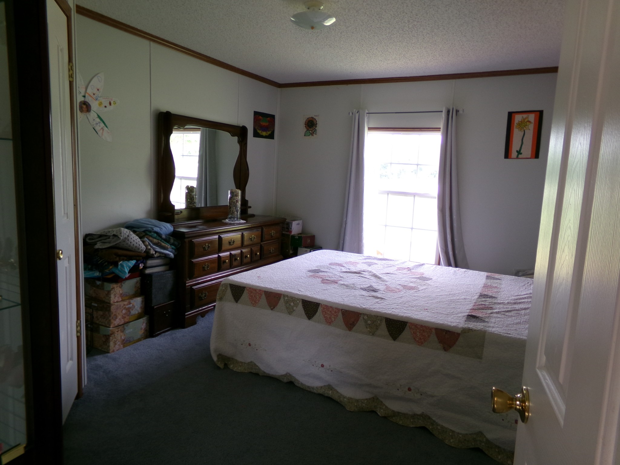 258 Paul Thompson Road Bethpage, TN 37022 - Photo 8 of 23 a bedroom with a bed and a mirror
