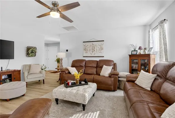 a living room with furniture or couch and a flat screen tv