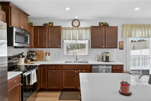 a kitchen with cabinets and window
