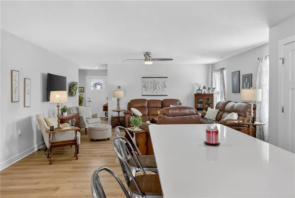 a living room with furniture a couch and a flat screen tv