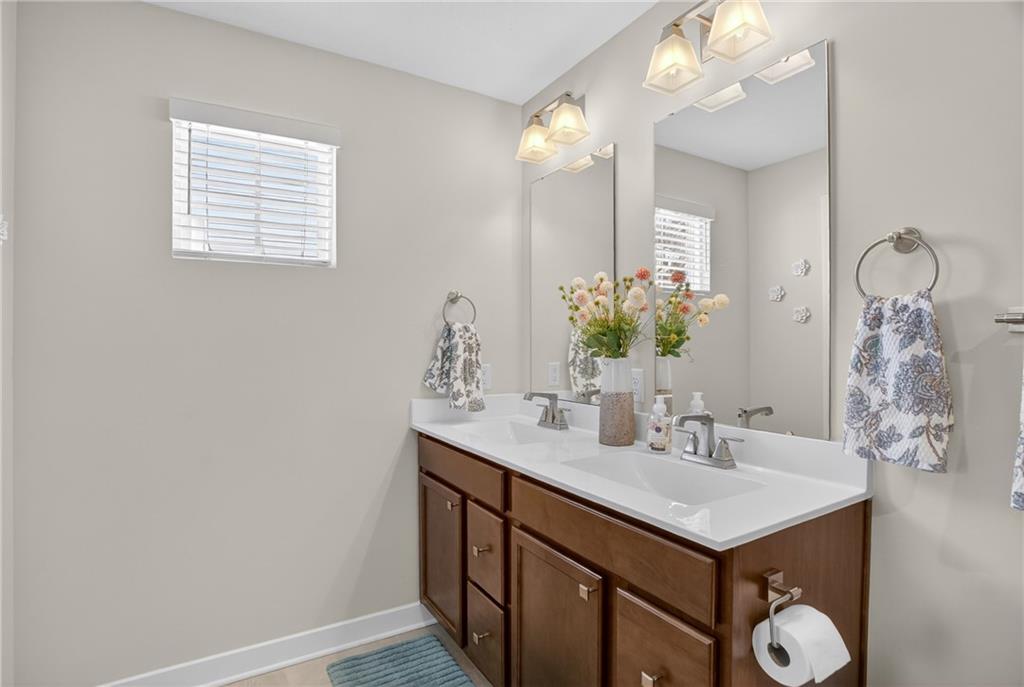 105 Horseshoe Loop Washington, PA 15301 - Photo 32 of 49 a bathroom with a sink vanity and a mirror