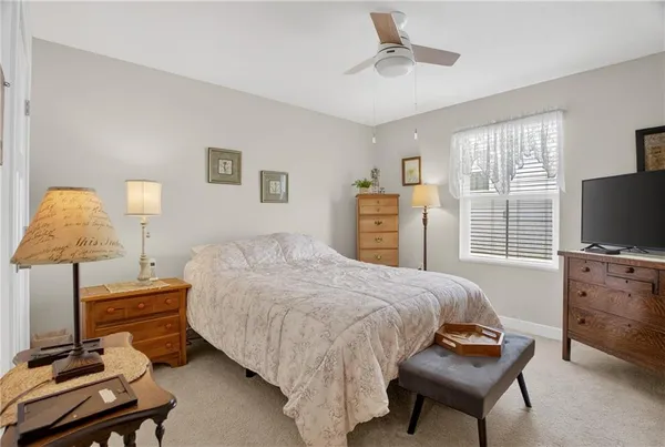 a bedroom with a bed and a couch