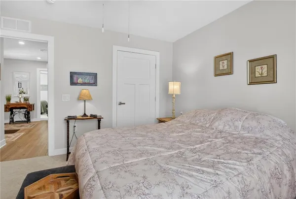 a bedroom with a bed and a dresser