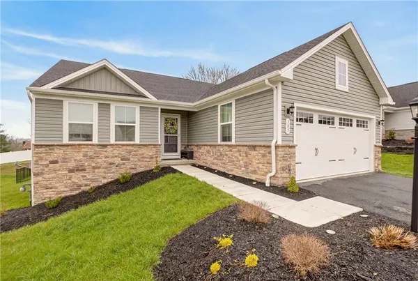 a view of a house with a yard