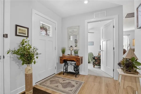 a living room with furniture and flowers