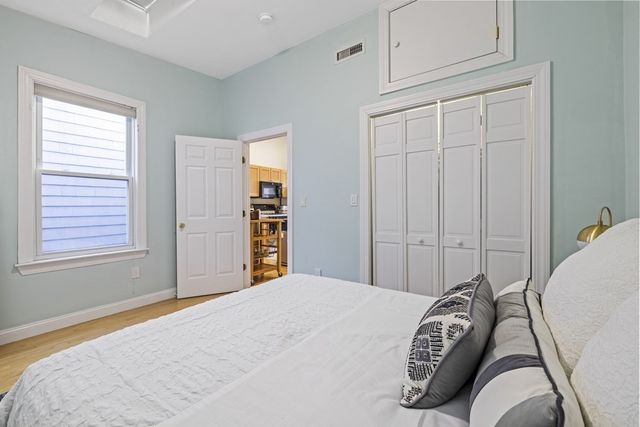 a bedroom with a bed and closet