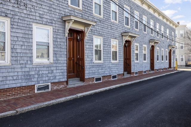 a view of a brick building with many windows