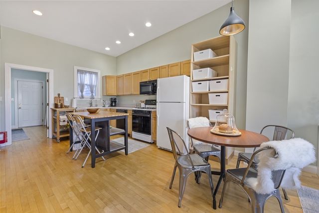 a view of a dining room with furniture and a table