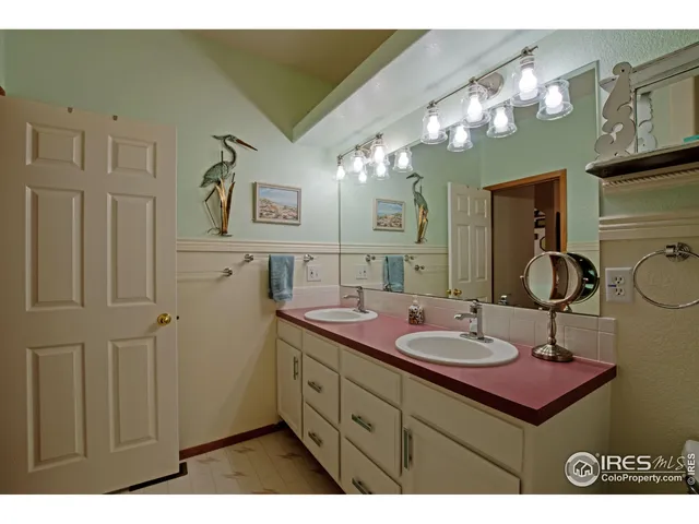 a bathroom with a sink vanity and a mirror