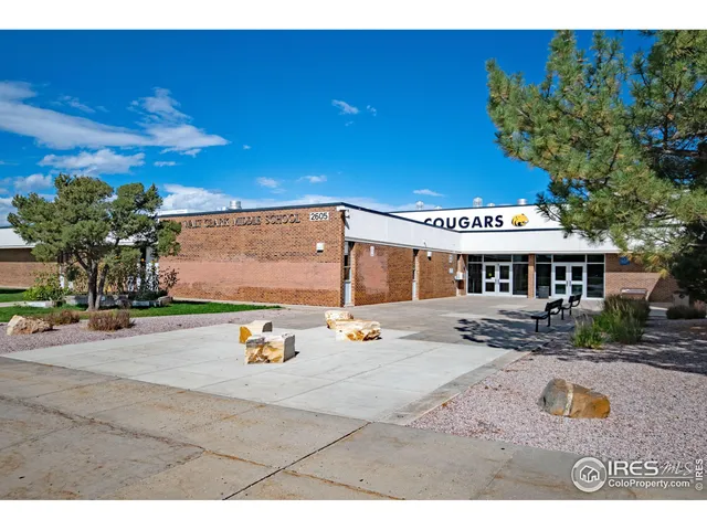 a view of a house with outdoor space and sitting area