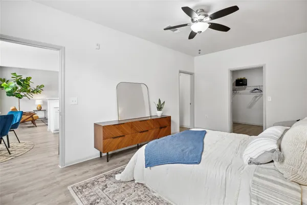 a bedroom with a bed and a couch