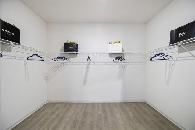 a room with a refrigerator and a television