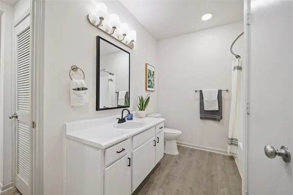 a spacious bathroom with a double vanity sink mirror and