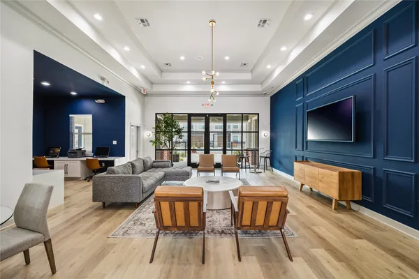 a living room with fireplace furniture and a flat screen tv