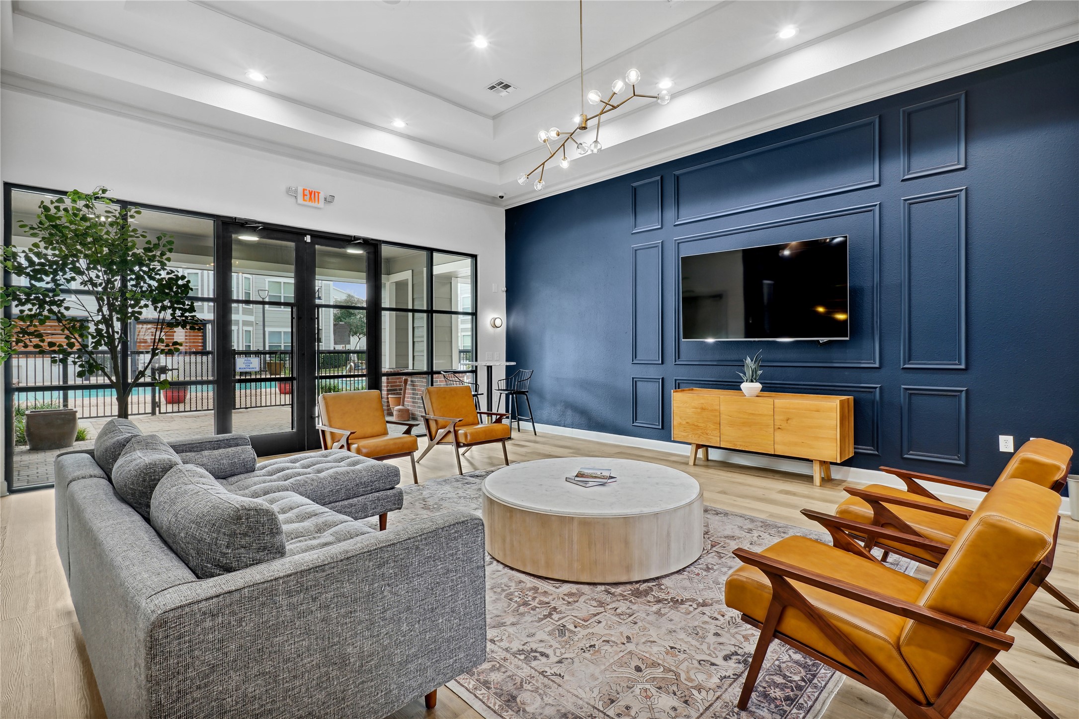 9494 Humble Westfield Road, Unit 934 Humble, TX 77338 - Photo 19 of 22 a living room with furniture and a flat screen tv