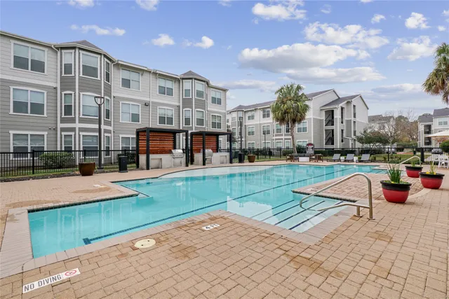 a view of a swimming pool with a lounge chairs