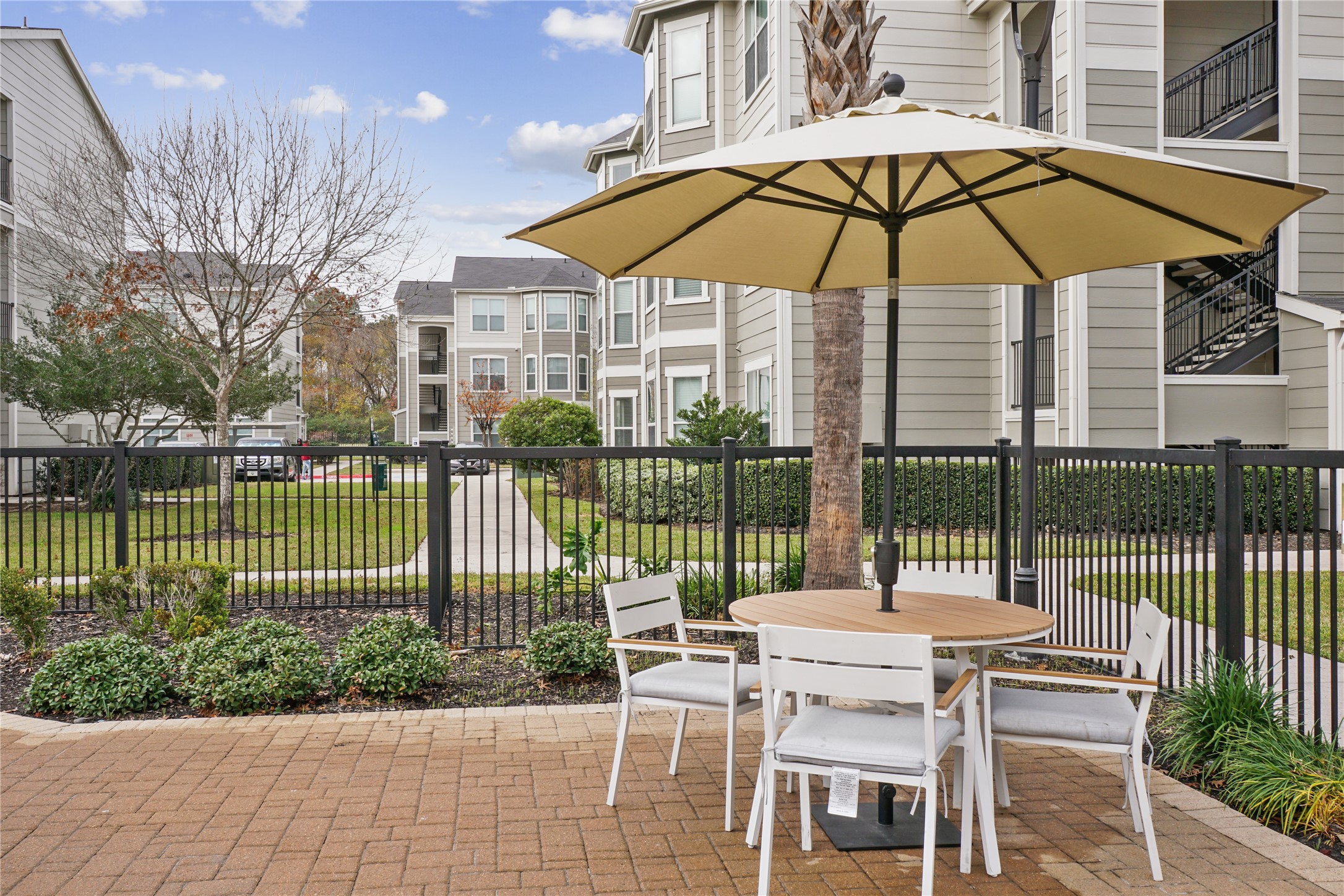9494 Humble Westfield Road, Unit 934 Humble, TX 77338 - Photo 5 of 22 a view of a chair and table in the garden