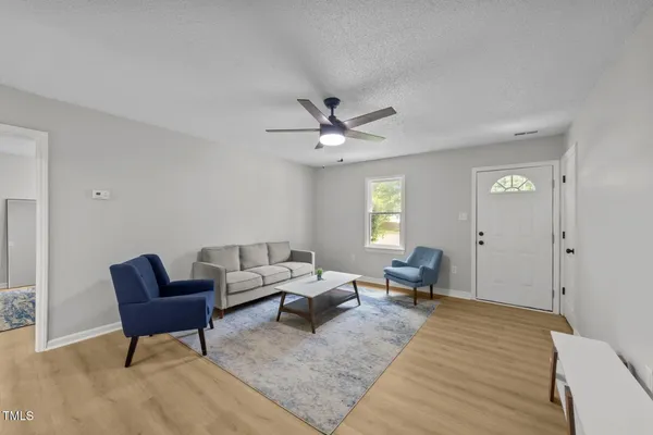 a living room with furniture and a window