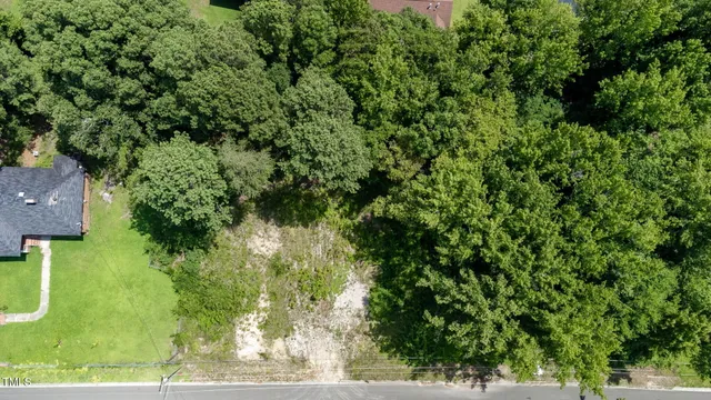 an aerial view of residential house with outdoor space