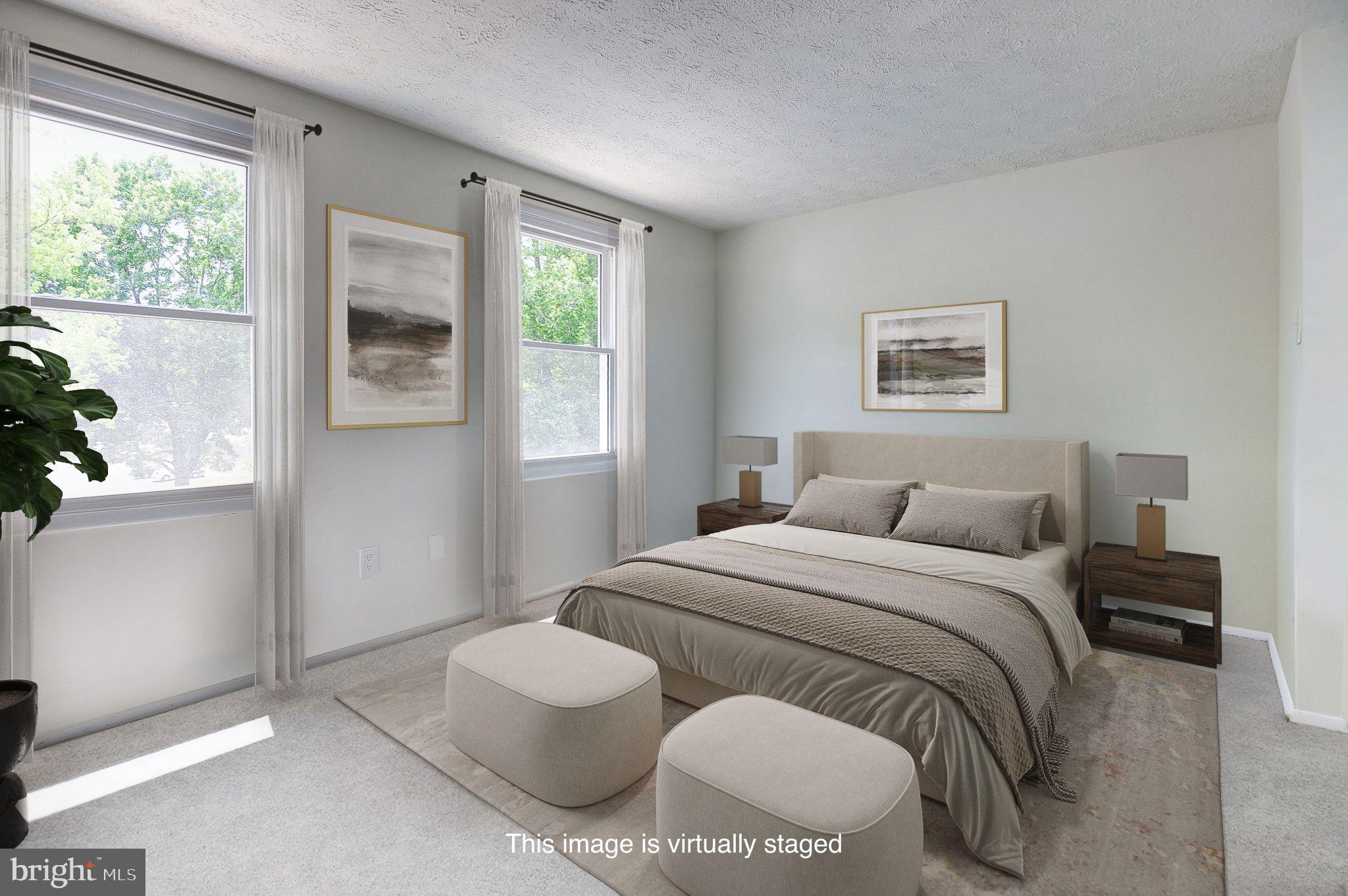 8416 Cedar Falls Court Springfield, VA 22153 - Photo 2 of 9 a bedroom with a bed and a window