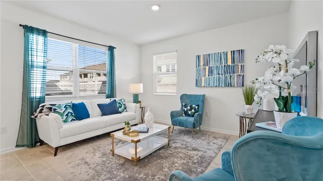a living room with furniture and a large window