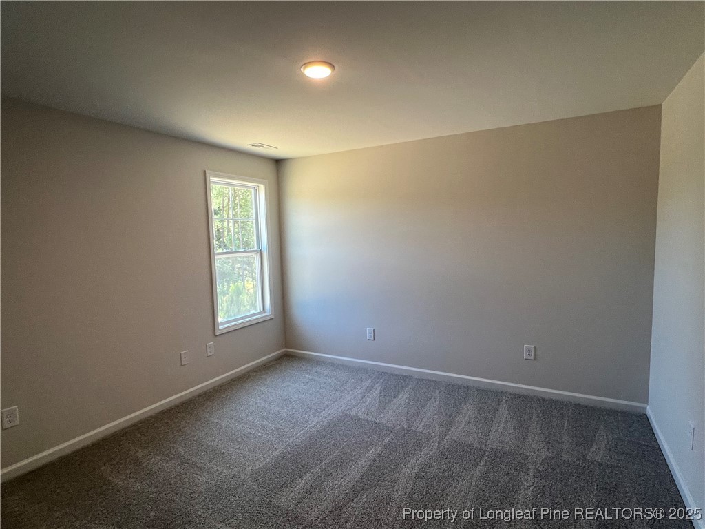 528 Traveller Way Raeford, NC 28376 - Photo 13 of 23 an empty room with a window