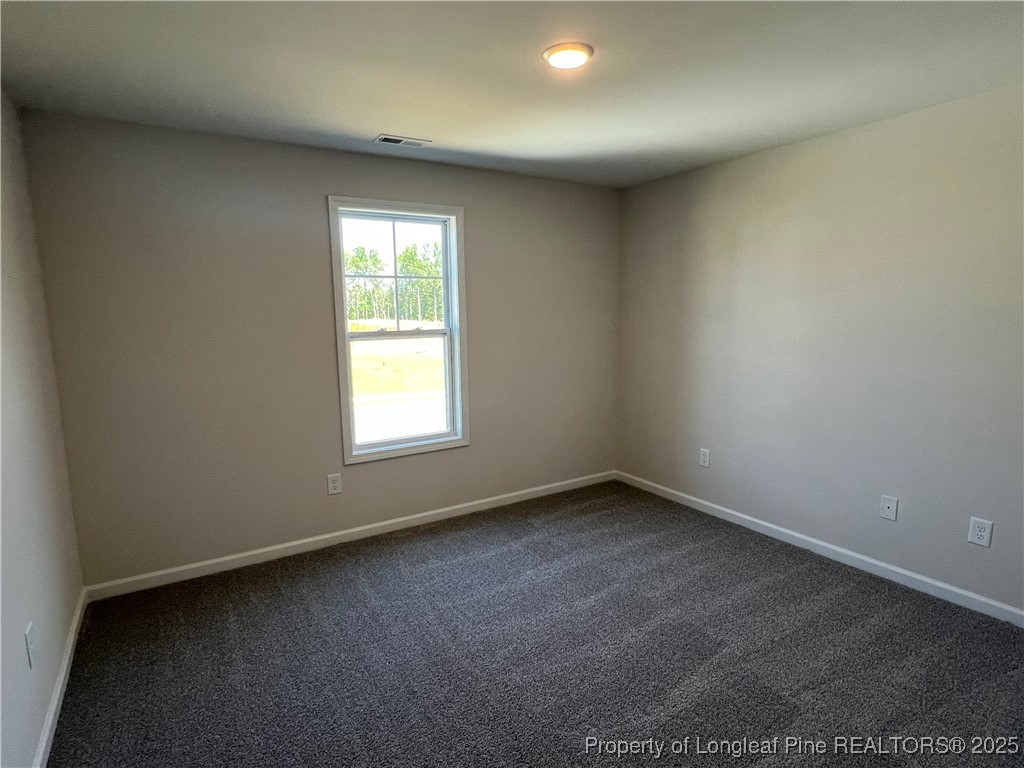 528 Traveller Way Raeford, NC 28376 - Photo 15 of 23 an empty room with a window