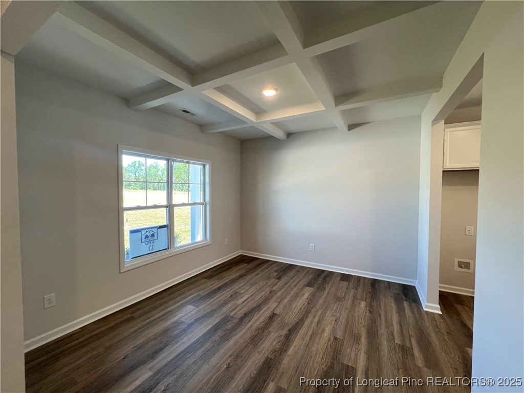 528 Traveller Way Raeford, NC 28376 - Photo 2 of 23 an empty room with wooden floor and windows